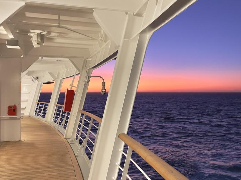 The deck of a cruise ship at sunset
