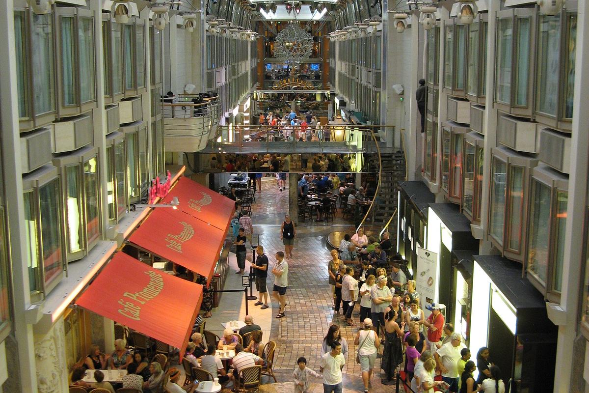 The Royal Promenade aboard Explorer of the Seas, an indoor street lined with shops and cafes