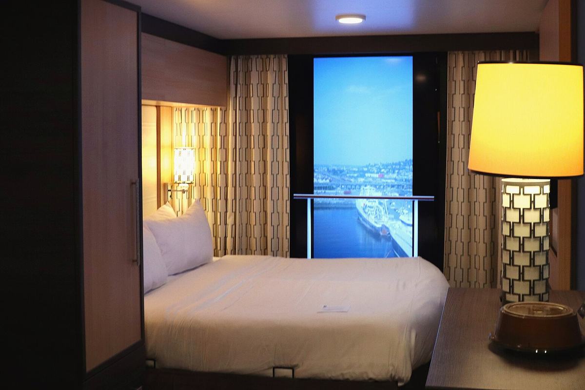 An inside cabin on Quantum of the Seas with a virtual window screen showing the view outside