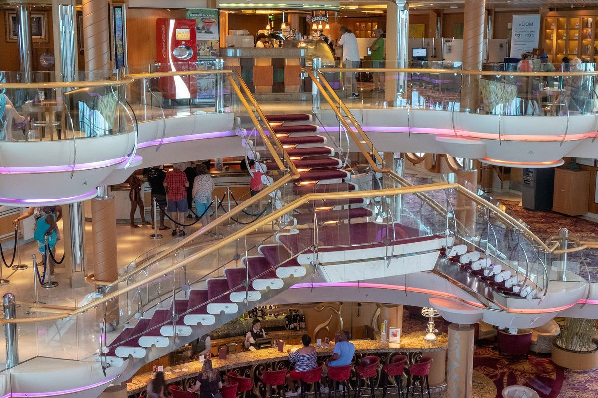 The multi-deck atrium and staircases aboard Enchantment of the Seas